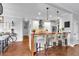 Modern kitchen with a breakfast bar, white cabinets, and pendant lighting, perfect for casual dining and entertaining guests at 4012 Ironhill Ln, Woodstock, GA 30189