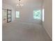 Large bedroom with vaulted ceilings, carpet flooring, and a barn door to the bathroom at 4450 Richmond Ct, Stone Mountain, GA 30083