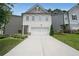 Charming two-story home featuring a two-car garage and well-maintained landscaping at 4450 Richmond Ct, Stone Mountain, GA 30083