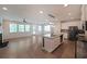 Open-concept kitchen and living area with granite island and stainless steel appliances at 4450 Richmond Ct, Stone Mountain, GA 30083