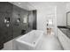 Contemporary bathroom featuring walk-in shower, soaking tub, and stylish tile at 4825 Gadwall Way, Cumming, GA 30028