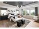 Spacious bedroom with tray ceiling, ample natural light, and hardwood floors at 4825 Gadwall Way, Cumming, GA 30028