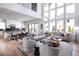 Open concept living room showcases a well-lit space, hardwood floors, and large windows with view the outdoor scenery at 4825 Gadwall Way, Cumming, GA 30028