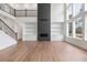 Bright living room with high ceilings, fireplace, built-in bookshelves, and a large window allowing natural light at 4825 Gadwall Way, Cumming, GA 30028