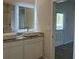Bathroom with white cabinets, light walls and a view of the walk in shower at 5381 Tolar Rd, South Fulton, GA 30213