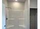 The bathroom features a glass-enclosed shower with white tile and a black shower head at 5381 Tolar Rd, South Fulton, GA 30213