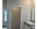The bathroom features a half glass shower and modern vanity at 5381 Tolar Rd, South Fulton, GA 30213