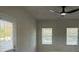 This naturally lit bedroom is completed with 3 large windows and a ceiling fan at 5381 Tolar Rd, South Fulton, GA 30213
