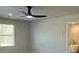 A bright bedroom is enhanced by a modern ceiling fan with a light kit and large windows at 5381 Tolar Rd, South Fulton, GA 30213