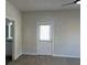 A bedroom is with neutral carpeting, light walls, a ceiling fan, and a door leading to another space at 5381 Tolar Rd, South Fulton, GA 30213