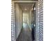 The foyer of the home has grey floors and white walls and leads to a main door at 5381 Tolar Rd, South Fulton, GA 30213