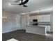 Spacious open concept kitchen features a large island with modern white cabinets at 5381 Tolar Rd, South Fulton, GA 30213