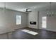 Bright living room featuring recessed lighting, a modern fireplace, and large windows at 5381 Tolar Rd, South Fulton, GA 30213