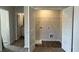Brightly lit mud room/laundry room combination with tile flooring at 5381 Tolar Rd, South Fulton, GA 30213