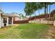 Spacious backyard featuring a well-maintained lawn and a wood fence for privacy at 10300 Medridge Cir, Johns Creek, GA 30022