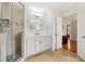 Beautiful bathroom featuring a step-in shower and views into the bedroom at 10300 Medridge Cir, Johns Creek, GA 30022