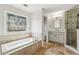 Bathroom with soaking tub under stained glass window and step-in shower at 10300 Medridge Cir, Johns Creek, GA 30022