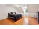 Spacious bedroom with a sloped ceiling, hardwood floors, and large window at 10300 Medridge Cir, Johns Creek, GA 30022