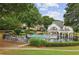 Relax and unwind at this community pool area surrounded by lush landscaping and amenities at 10300 Medridge Cir, Johns Creek, GA 30022