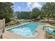 Enjoy resort-style living with this large community pool and surrounding amenities at 10300 Medridge Cir, Johns Creek, GA 30022