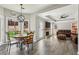Open concept living room with a dining nook, and a view of the backyard at 10300 Medridge Cir, Johns Creek, GA 30022