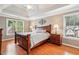 Cozy main bedroom with natural light, ceiling fan, and ensuite at 10300 Medridge Cir, Johns Creek, GA 30022