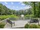Serene pond view from the deck, perfect for relaxation and enjoying nature at 10300 Medridge Cir, Johns Creek, GA 30022