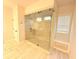 Walk-in shower, with tile bench, encased in glass at 1923 Westfall Lndg, Auburn, GA 30011
