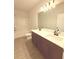 Bathroom with double sink vanity, wood cabinets and tub/shower combination at 1923 Westfall Lndg, Auburn, GA 30011