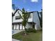Striking home with two-car garage and manicured lawn, a perfect suburban retreat at 1923 Westfall Lndg, Auburn, GA 30011