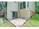A walkout basement patio featuring stone edging, perfect for outdoor entertaining and relaxation at 2212 Mcquiston Sw Dr, Marietta, GA 30064