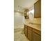 Bathroom featuring granite countertops, wooden cabinetry, and a tub with shower at 2212 Mcquiston Sw Dr, Marietta, GA 30064