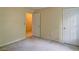 Cozy bedroom with neutral walls and carpet, with access to closet and hallway at 2212 Mcquiston Sw Dr, Marietta, GA 30064