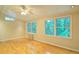 Bedroom with hardwood flooring, wainscoting, and large windows at 2212 Mcquiston Sw Dr, Marietta, GA 30064