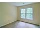 Bedroom featuring carpet, neutral walls, and a large window letting in light at 2212 Mcquiston Sw Dr, Marietta, GA 30064