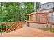 A spacious wood deck with decorative lattice, perfect for outdoor relaxation and entertaining guests at 2212 Mcquiston Sw Dr, Marietta, GA 30064