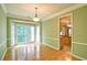 Bright dining room featuring a bay window and a stylish chandelier at 2212 Mcquiston Sw Dr, Marietta, GA 30064