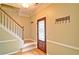 Inviting foyer featuring a staircase and a decorative glass front door at 2212 Mcquiston Sw Dr, Marietta, GA 30064