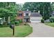 Charming home featuring a well-manicured lawn and lush landscaping at 2212 Mcquiston Sw Dr, Marietta, GA 30064