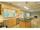 Spacious eat-in kitchen featuring a breakfast bar, tile flooring and stainless steel appliances at 2212 Mcquiston Sw Dr, Marietta, GA 30064