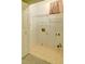 Functional laundry room features white shelving and neutral tile flooring, ready for your washer and dryer at 2212 Mcquiston Sw Dr, Marietta, GA 30064