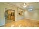 Living room with hardwood floors and a kitchen view through a breakfast bar at 2212 Mcquiston Sw Dr, Marietta, GA 30064