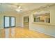Living room featuring hardwood floors, wainscoting and a view to the eat-in kitchen at 2212 Mcquiston Sw Dr, Marietta, GA 30064