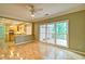 Open-concept living room features hardwood floors and view to the deck through glass patio doors at 2212 Mcquiston Sw Dr, Marietta, GA 30064