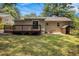 Home exterior view of back deck, lawn, and partial brick and siding at 2912 Springside Se, Atlanta, GA 30354