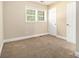 Bedroom featuring neutral carpet, blinds, and a white door and trim at 2912 Springside Se, Atlanta, GA 30354
