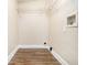 Walk-in closet with wooden floors, white walls, and metal shelving at 2912 Springside Se, Atlanta, GA 30354