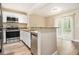 Open kitchen with stainless steel appliances and sliding glass doors at 2912 Springside Se, Atlanta, GA 30354
