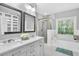 Bright bathroom with double vanity, soaking tub, and separate glass enclosed shower at 3541 Roswell Ne Rd # 21, Atlanta, GA 30305