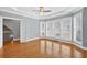 Bright bedroom with hardwood floors, large windows, and an staircase at 3541 Roswell Ne Rd # 21, Atlanta, GA 30305